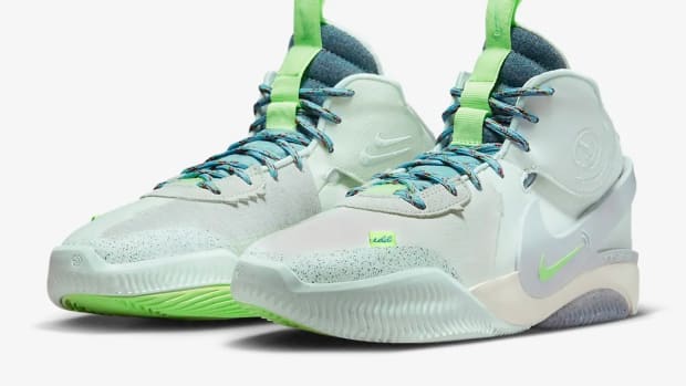 View of green and blue Nike shoes.